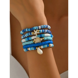 Trendsi blue stackable beach bracelets featuring beads and ocean-themed charms on wrist