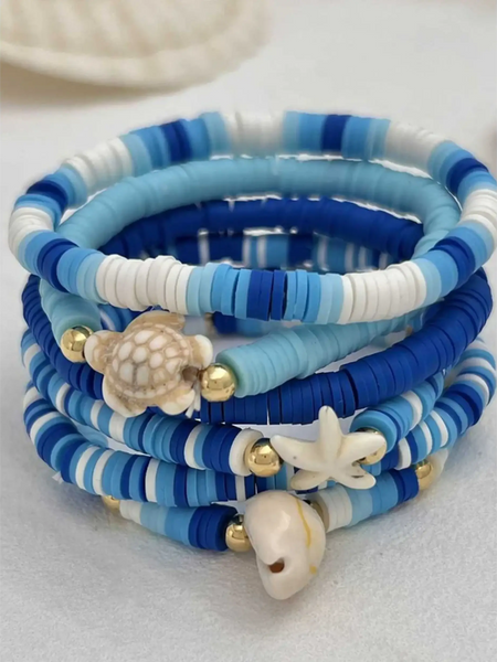 Trendsi blue stackable beach bracelets with sea shell and starfish charms in various shades of blue and white