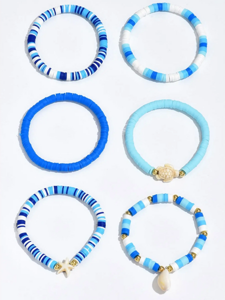 Trendsi blue stackable beach bracelets in various shades with shell and starfish charms