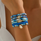 Trendsi blue stackable beach bracelets with starfish and shell charms on wrist