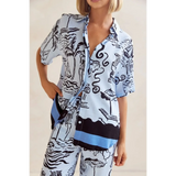 Trendsi blue summer lounge set for curvy women featuring abstract black and white tropical patterns