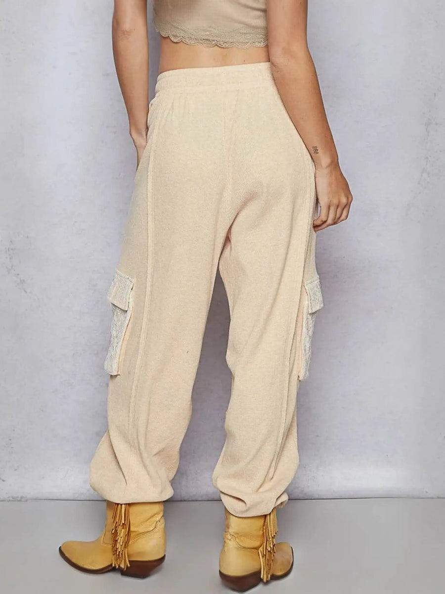Trendsi beige cargo pants with side pockets worn with tan fringe ankle boots