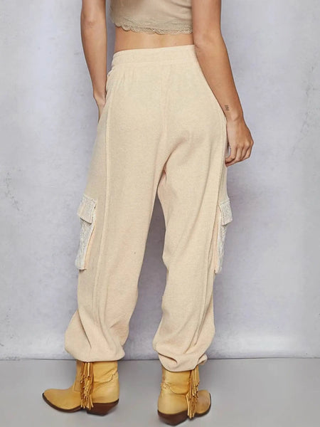 Trendsi beige cargo pants with side pockets worn with tan fringe ankle boots