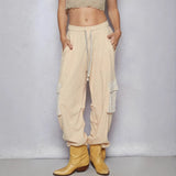 Trendsi beige Cargo Pants with drawstring waist and side pockets styled with tan boots