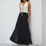 Babe Beachwear black maxi skirt with side buttons styled as casual chic vacation skirt