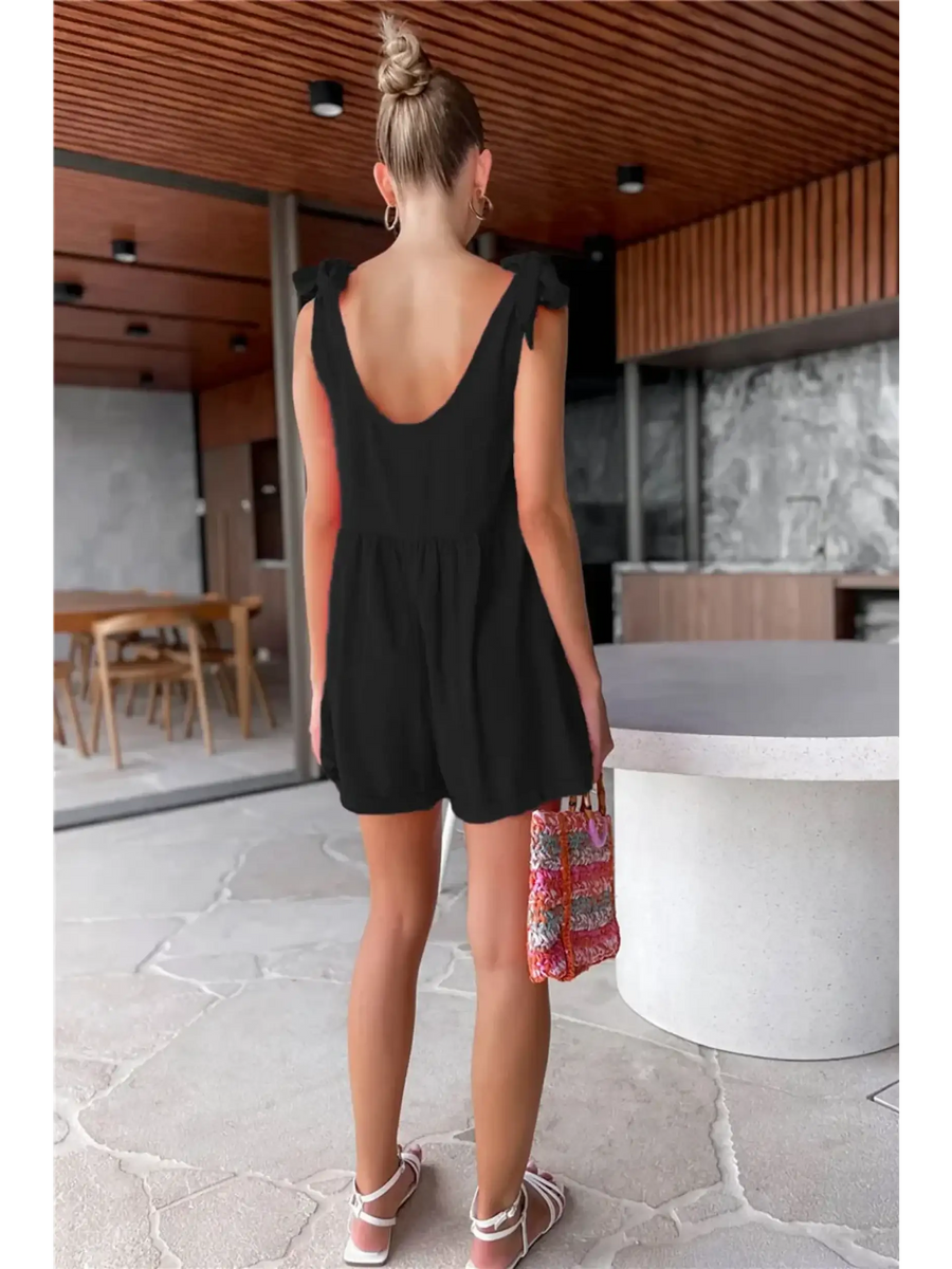 Trendsi casual white vacation romper worn by woman in modern indoor setting from back view