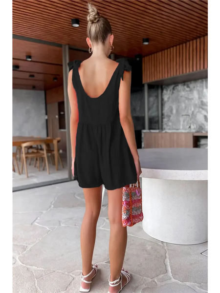 Trendsi casual white vacation romper worn by woman in modern indoor setting from back view