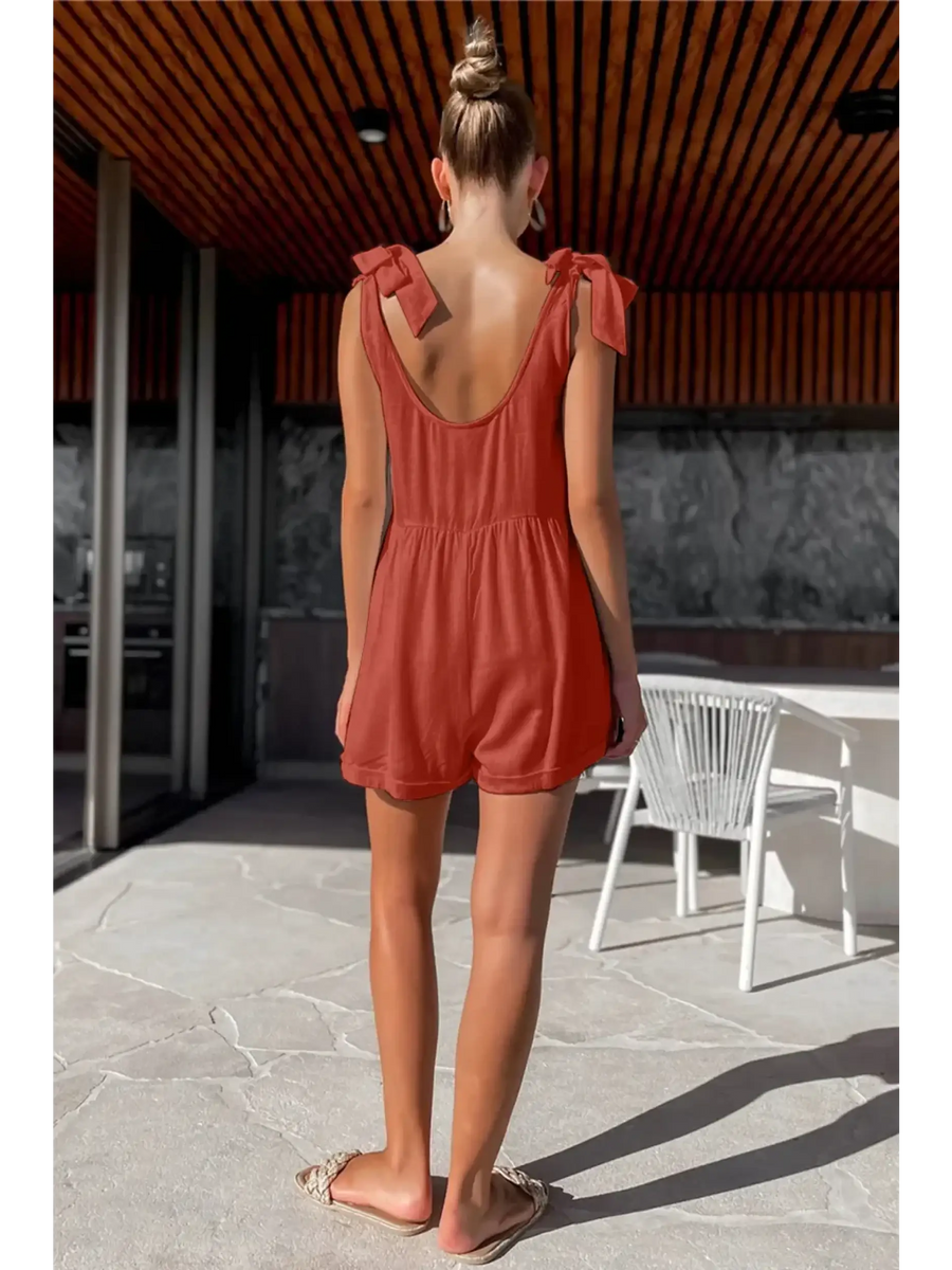 Trendsi casual white vacation romper shown on model from back in rust color with tie shoulder straps