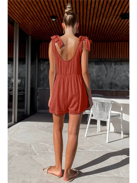 Trendsi casual white vacation romper shown on model from back in rust color with tie shoulder straps