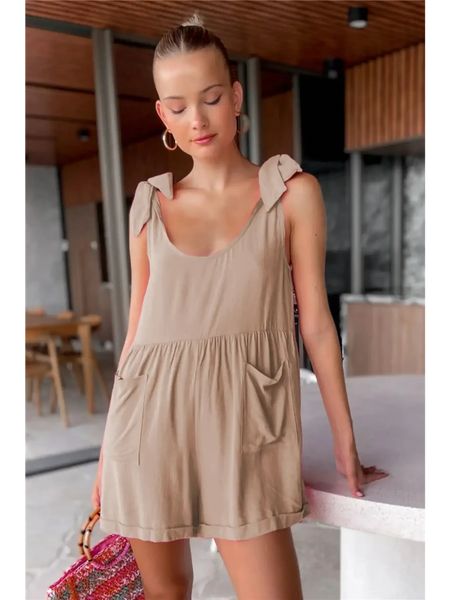 Trendsi casual white vacation romper worn by woman in a stylish indoor setting