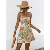Babe Beachwear chic floral sundress for women with ruffle straps and tropical print worn with sun hat and sunglasses