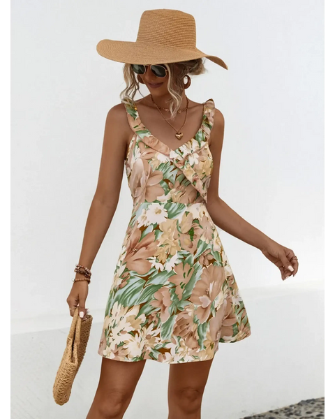 Babe Beachwear chic floral sundress for women with ruffle straps and tropical print worn with sun hat and sunglasses