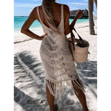 Babe Beachwear chic tassel beach dress coverup worn by woman on tropical sandy beach