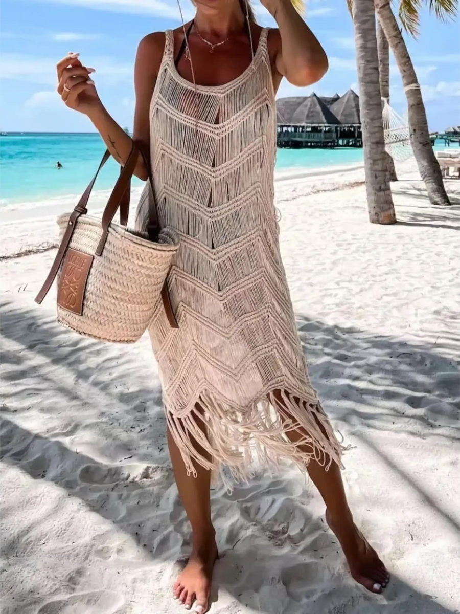 Babe Beachwear chic tassel beach dress coverup in beige with fringe details worn on sandy tropical beach
