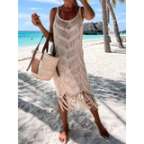Babe Beachwear chic tassel beach dress coverup in beige with fringe details worn on sandy tropical beach