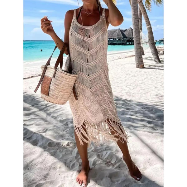 Babe Beachwear chic tassel beach dress coverup in beige with fringe details worn on sandy tropical beach