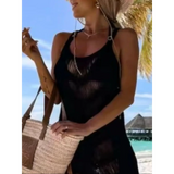 Babe Beachwear chic tassel beach dress black coverup worn by woman at tropical beach with straw bag
