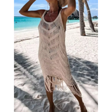 Babe Beachwear chic tassel beach dress coverup in beige knitted design worn on tropical sandy beach