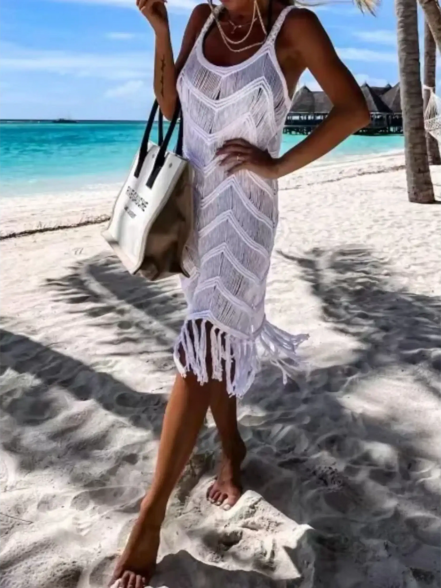 Babe Beachwear white chic tassel beach dress coverup worn on sandy tropical beach with turquoise ocean