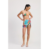 Emory Park chic vacation sarong skirt with colorful tropical print worn by woman with bandeau top