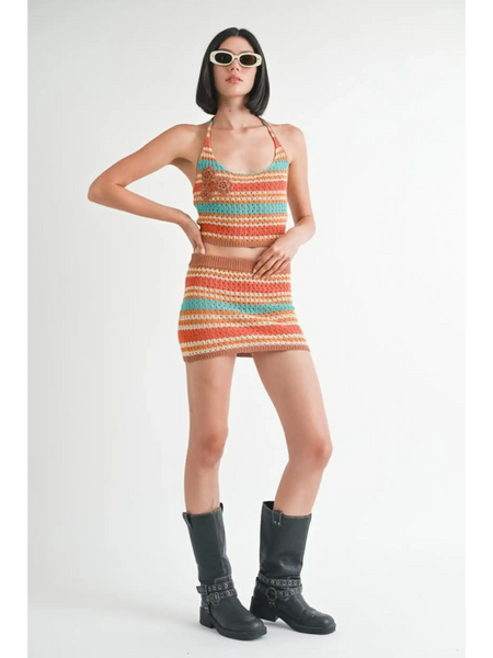Emory Park colorful crochet two piece outfit with halter top and mini skirt styled with black boots