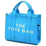 Fashion World blue Compact Tote Bag Satchel with structured design and dual top handles