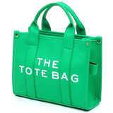 Fashion World green Compact Tote Bag Satchel with sturdy handles and printed text on front