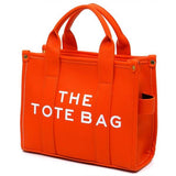 Fashion World bright orange Compact Tote Bag Satchel with sturdy handles and side pockets