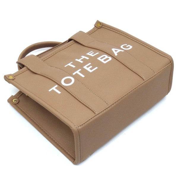 Fashion World Compact Tote Bag Satchel in tan with white printed text and sturdy handles