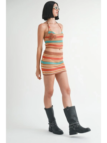 Emory Park crochet halter crop top in multicolor striped pattern worn with matching skirt and black boots