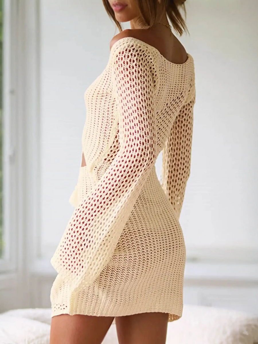 Babe Beachwaer cutout crochet beach mini coverup in beige worn by model indoors