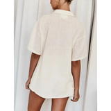 Woman wearing a loose beige embroidered shorts set for women with short sleeves and collar from Trendsi