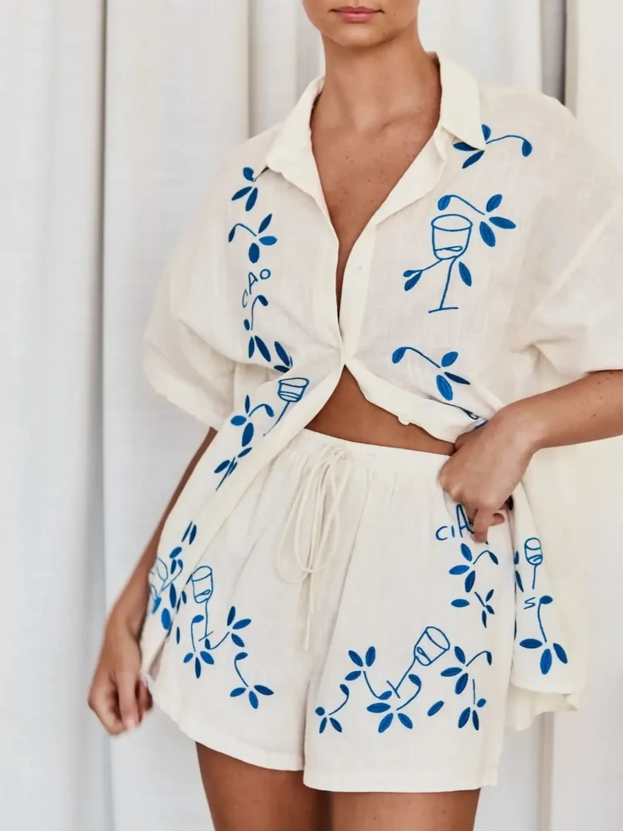 Trendsi embroidered shorts set for women in white with blue vine and wine glass design