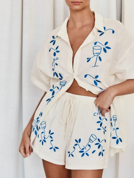 Trendsi embroidered shorts set for women in white with blue vine and wine glass design