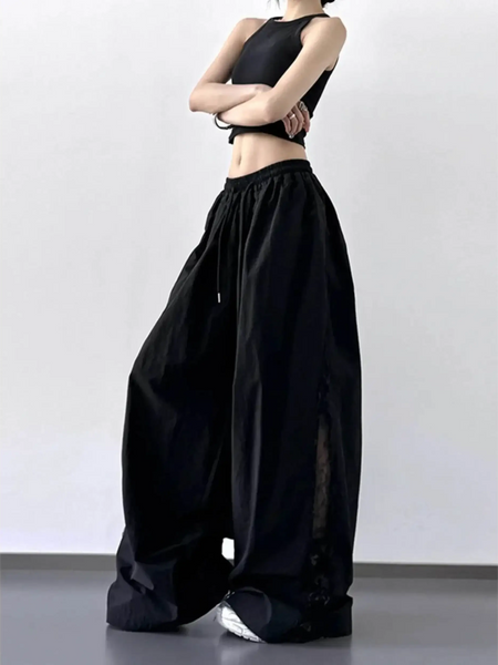 Babe Beachwear black extra wide leg flowing beach pants with drawstring waist worn with black crop top