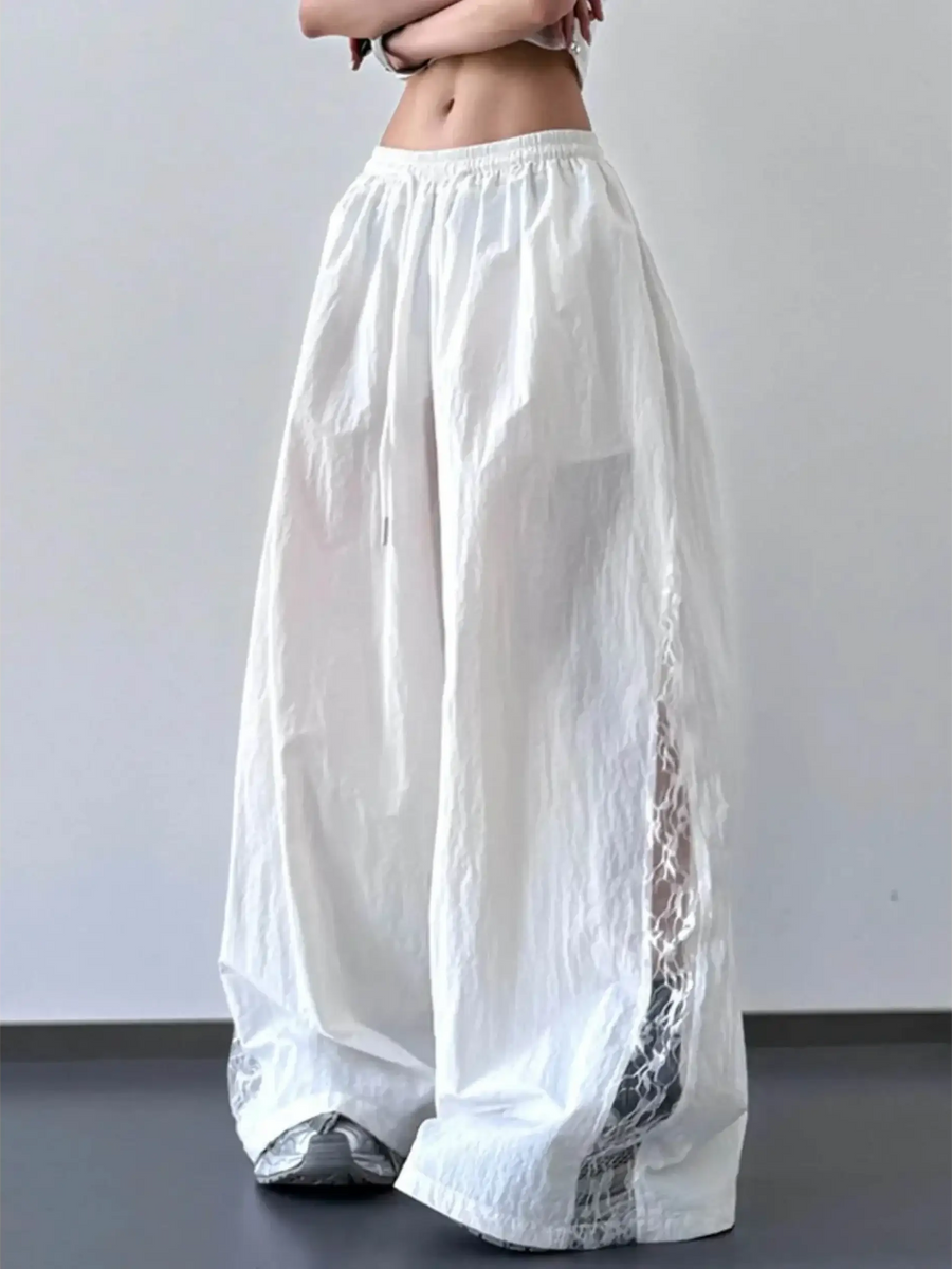 Babe Beachwaer white extra wide leg flowing beach pants with side mesh details and elastic waistband