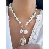 Fashionable Shell Resort Necklace by Trendsi featuring white star-shaped beads and hanging shell charms