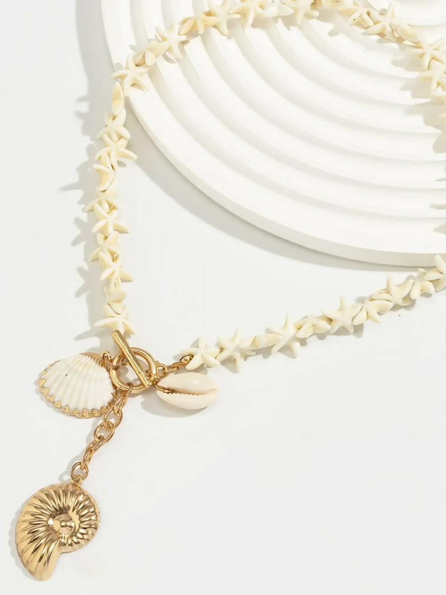 Fashionable Shell Resort Necklace with cream shell beads and gold tone shell charms by Trendsi