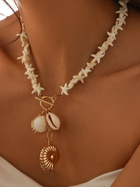 Fashionable Shell Resort Necklace by Trendsi featuring starfish and gold shell charms on model's neck