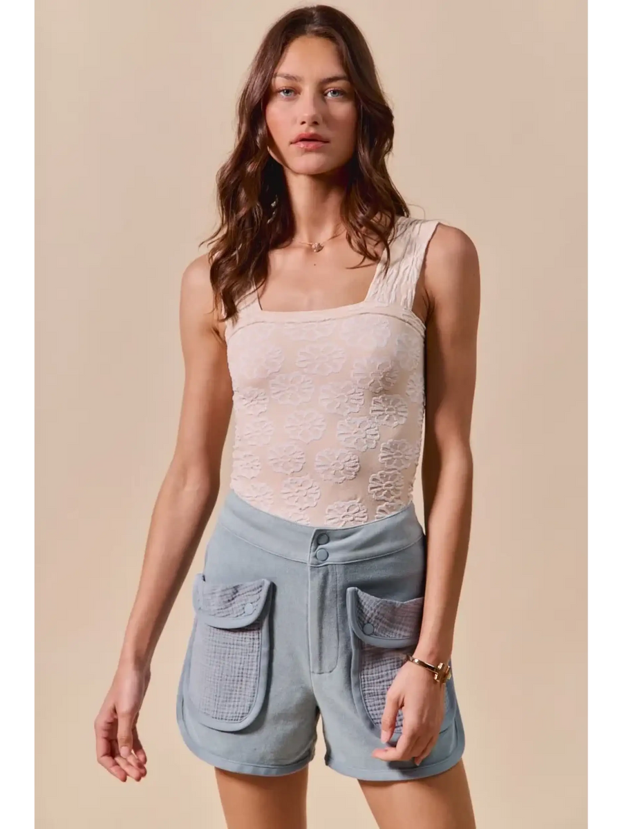 Trendsi High Rise Cargo Shorts in light blue with large front pockets worn by a female model