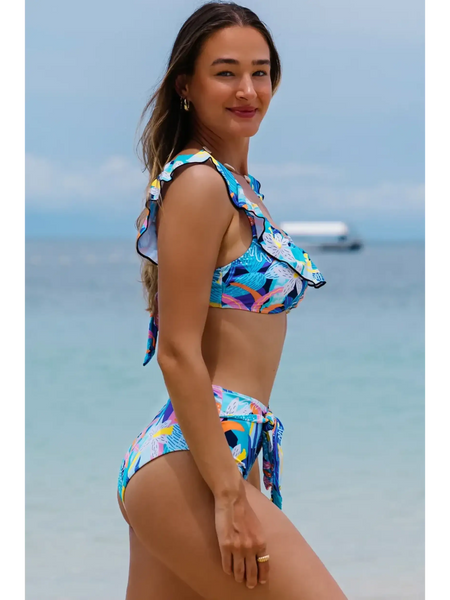 Trendsi High Waist Bikini Set with Support Top featuring colorful tropical print and ruffle straps on beach