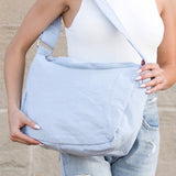 Babe Beachwear Large Nylon Messenger Bag in light blue worn crossbody with adjustable strap