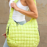 Babe Beachwear Lightweight Large Quilted Puffer Shoulder Bag in bright yellow worn by model