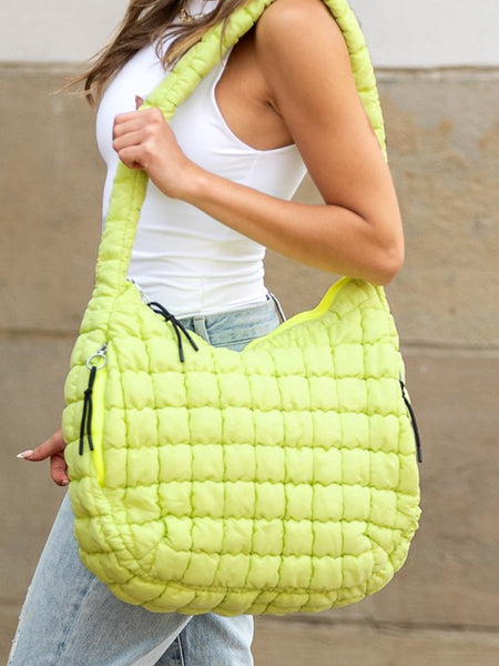 Babe Beachwear Lightweight Large Quilted Puffer Shoulder Bag in bright yellow worn by model