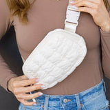 Babe Beachwear Lightweight Puffer Sling Bag in white worn with casual brown top and blue jeans