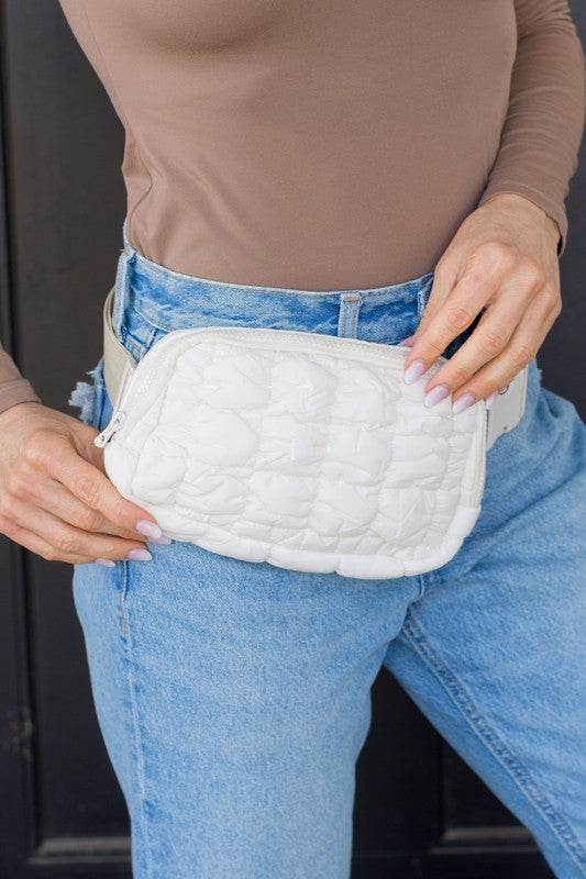 Babe Beachwaer Lightweight Puffer Sling Bag in white worn with casual outfit