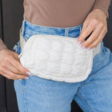 Babe Beachwaer Lightweight Puffer Sling Bag in white worn with casual outfit