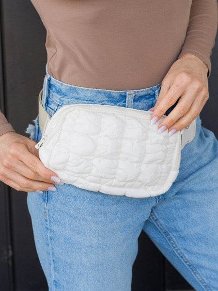 Babe Beachwaer Lightweight Puffer Sling Bag in white worn with casual outfit