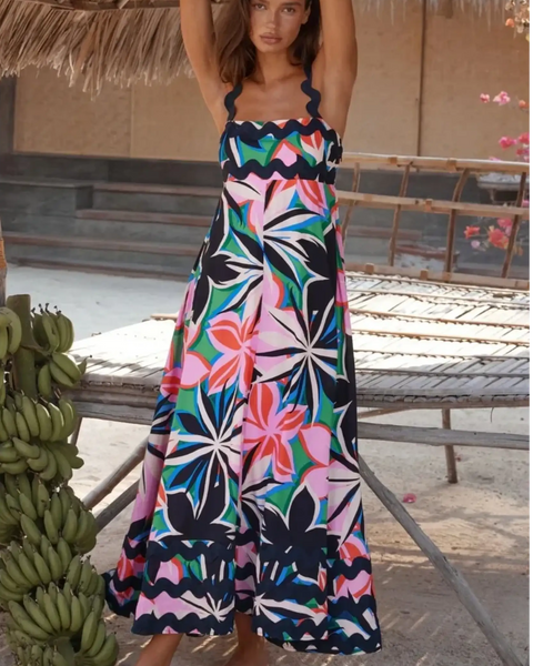 Trendsi maxi dress featuring a colorful floral pattern on a navy blue resort dress perfect for beach vacations