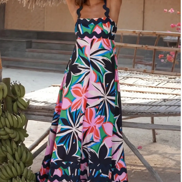 Trendsi maxi dress featuring a colorful floral pattern on a navy blue resort dress perfect for beach vacations